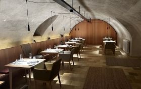 A stylish room with a staircase and lanterns.